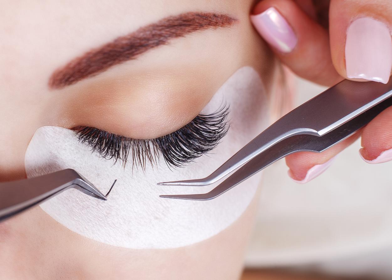 Closeup woman receiving eyelash extensions